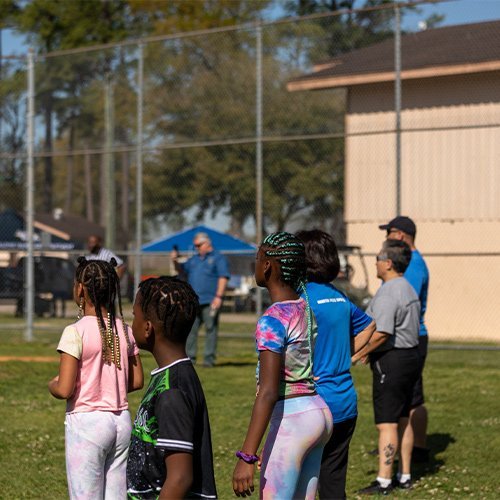 Kids celebrating with coaches